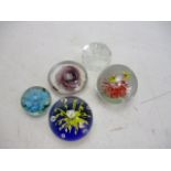 Selection of vintage glass paperweights.
