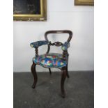 Reupholstered Victorian music chair.