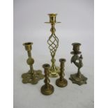 Collection of brass candlesticks.
