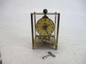 Vintage Kundo glass panelled German mantle clock, with key.