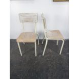 Vintage pair of tubular stackable chairs.