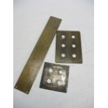 Collection of vintage brass light switch covers and door finger plates.