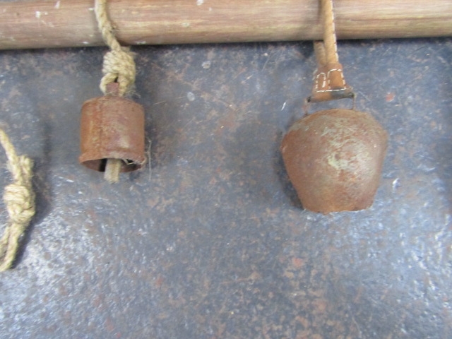 Collection of 4 vintage cow bells on a wooden harness - Image 3 of 3