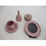 Selection of pink Jasperware Wedgwood to include bell cup, saucer, trinket Lot 7