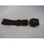 Large vintage cow bell on a leather strap