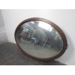 1930's bevelled mirror oval mirror. 77 x 51cms.