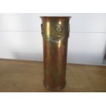 Large vintage trench art shell with applied cap badges 26cm high