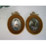 A pair of vintage hand painted pictures in velvet covered frames and backed in silk