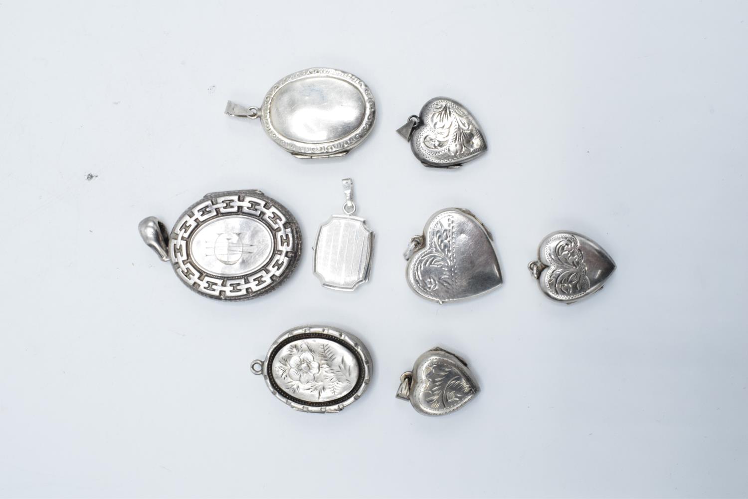 A collection of assorted silver lockets: mix of hallmarked, sterling and 925 examples (40.1 grams to