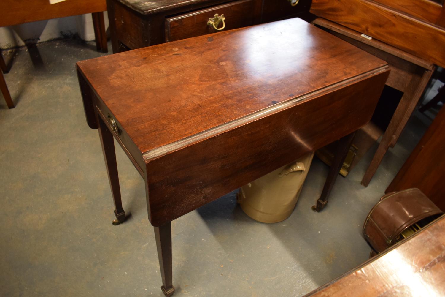 Mahogany drop leaf table on casters
