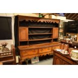 George III oak dresser base with later rack with ogee moulded cornice with cabriole legs (very good