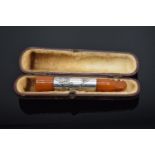 Boxed silver and amber cigar holder: 8cm long (no hallmark)