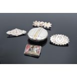 A collection of Victorian silver brooches and a large silver lockett (5) (36.1 grams)