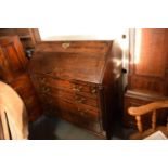 Georgian oak bureau with brass fixtures