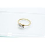 18ct gold and 3 stoned diamond ladies ring (2.9 grams total weight)