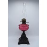 Victorian cranberry oil lamp with a later chimney. Untested condition. Some damage to metalwork. See