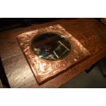 Arts and Crafts copper framed mirror. Tthe copper is battered and bruised consistently on the piece.