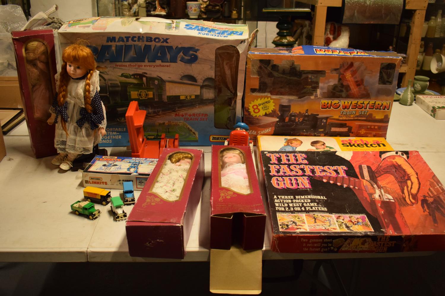 A mixed collection of items to include childrens toys, dolls, modern Corgi cars etc (lots of wear)