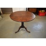 Victorian oak circular tilt top table. Signs of old worm and usage, still functional. 81cm diameter,