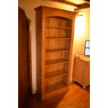 20th century tall pine bookcase. In good condition with signs of wear and use. 80 x 38 x 194 cm