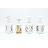 A collection of opaque Victorian glass bottles with floral decorations (4) 1 clean example, the