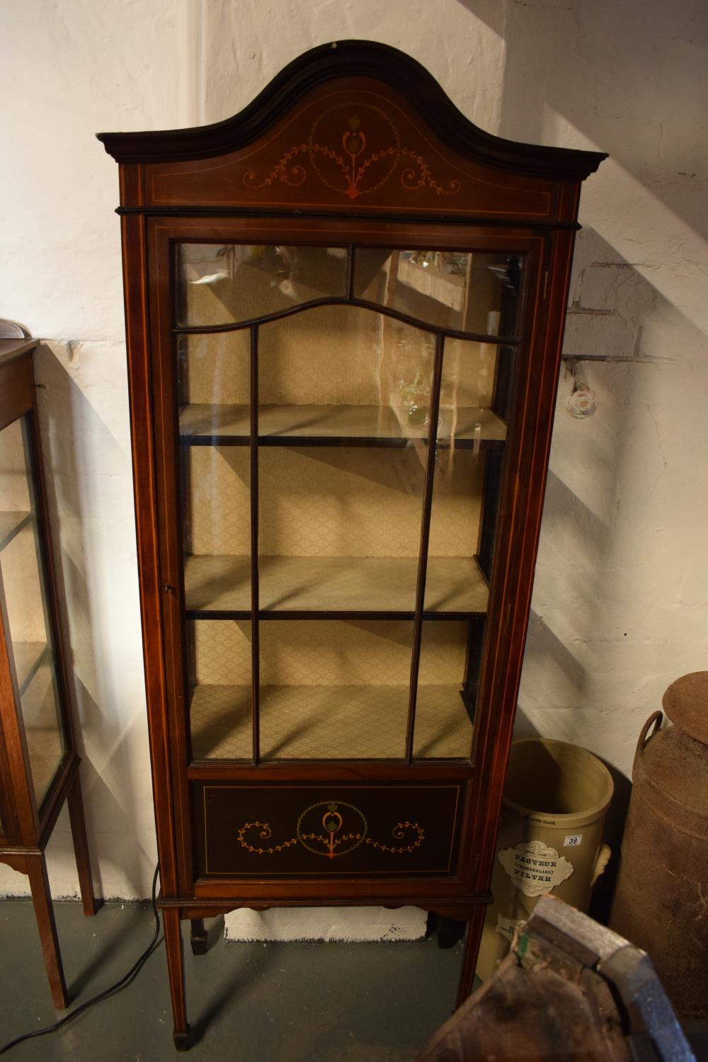 Edwardian inlaid mahogany and glass display cabinet. There is a crack to one leg. worm is