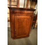 Late Georgian oak inlaid corner cabinet with a bone escutcheon. Some wear and old worm is