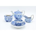 A blue and white part miniature tea set including teapot, milk and sugar (no lid), cup and deep