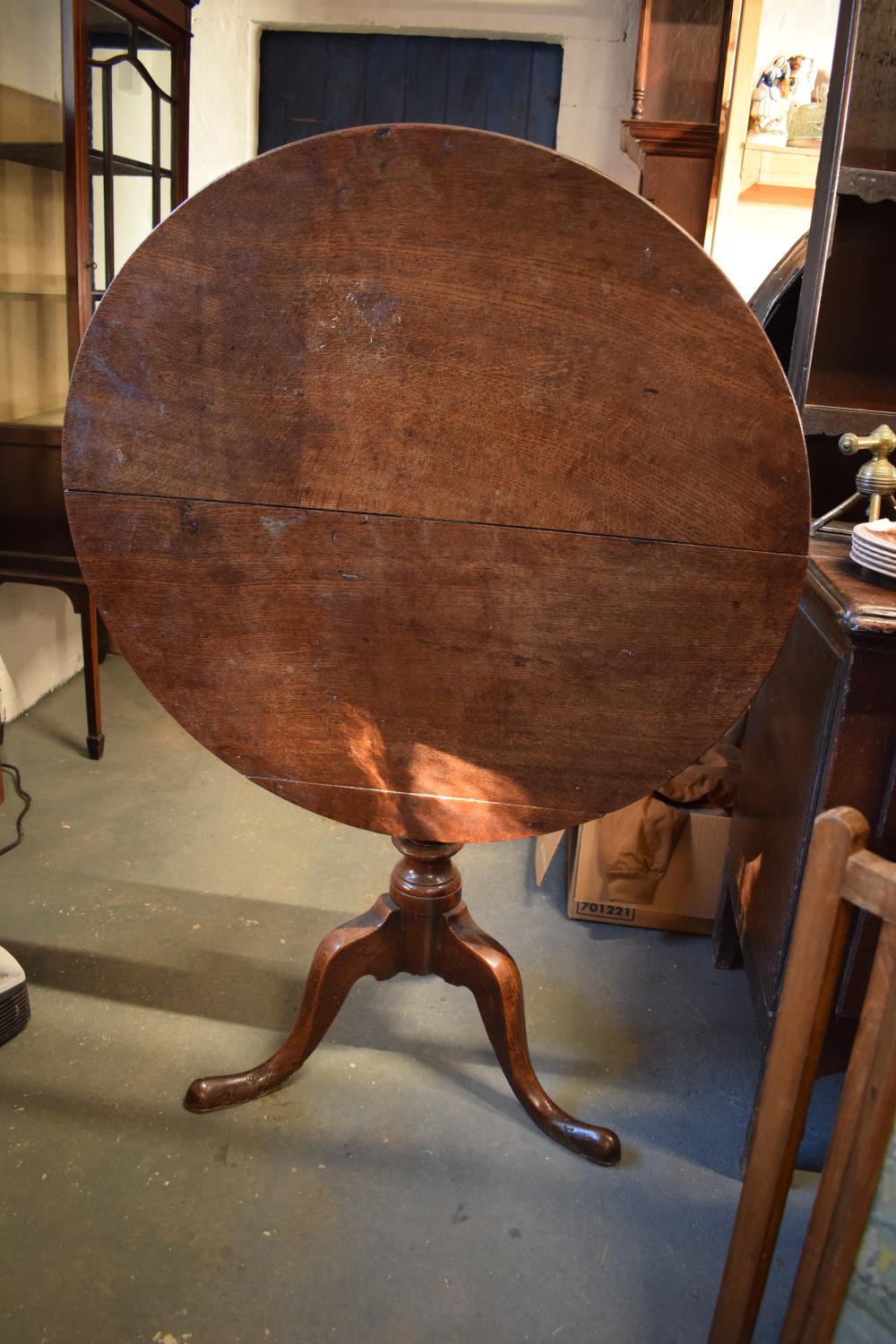 Victorian oak circular drop leaf table. One plank has been reglued on the top. Repair to the block