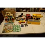 A mixed collection of vintage toys to include dumper trucks, Codeg Melody Bells etc Condition is