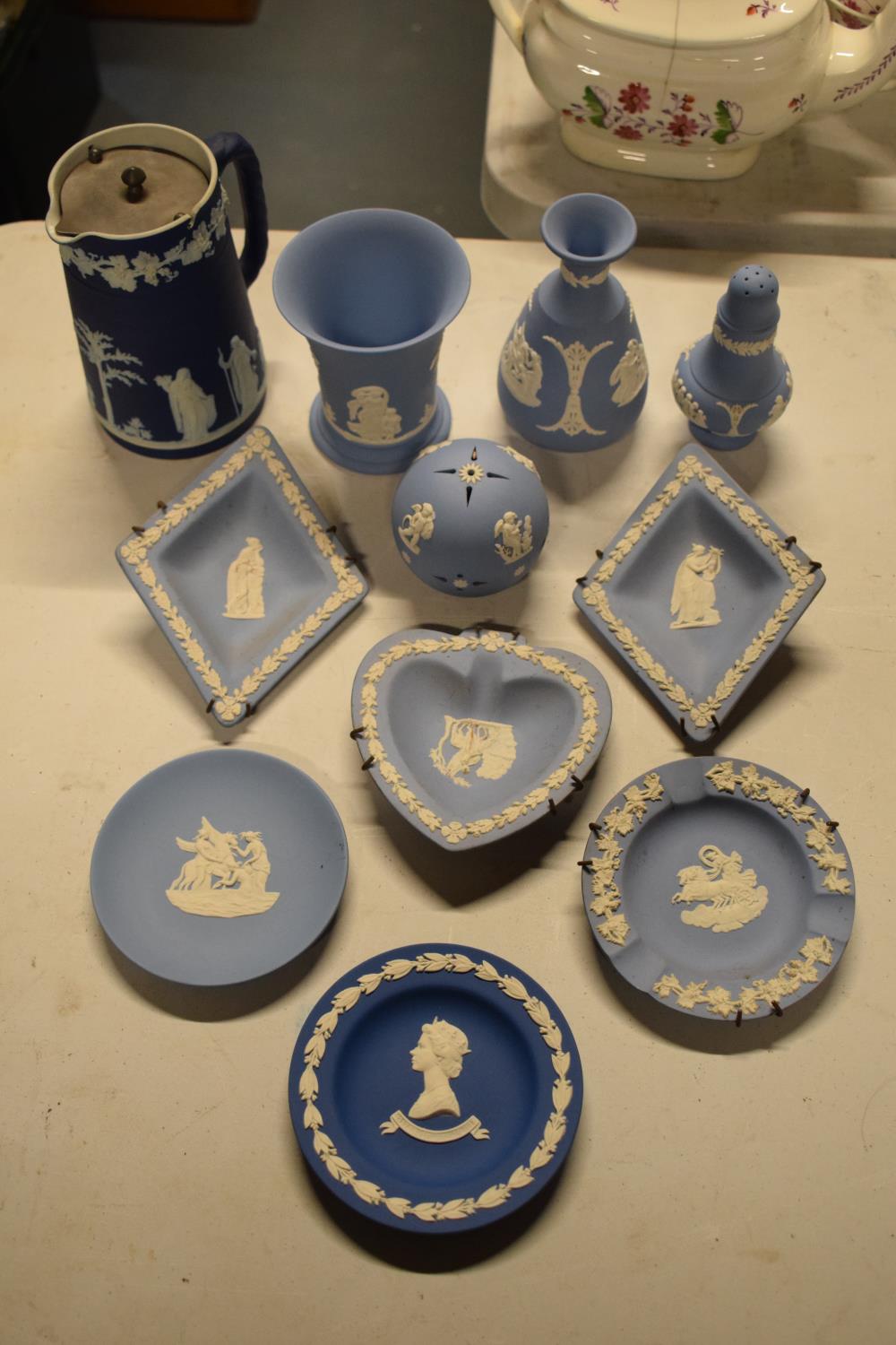 A collection of blue Wedgwood Jasperware to include dip blue jug, lavender holder etc (11 pieces)