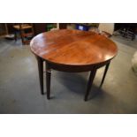 Victorian mahogany circular dining table with one spare leaf. De-assembled. Sign of wear and tear.