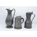 Early 19th century pewter to include a flagon, a jug and a lidded tankard (3) As expected. Flagon