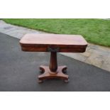 Late Victorian rosewood fold-over games table. The piece functions well and folds/ slides well.