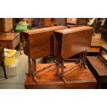 Near pair of Edwardian Sutherland mahogany tables both with turned legs: one on casters. Some