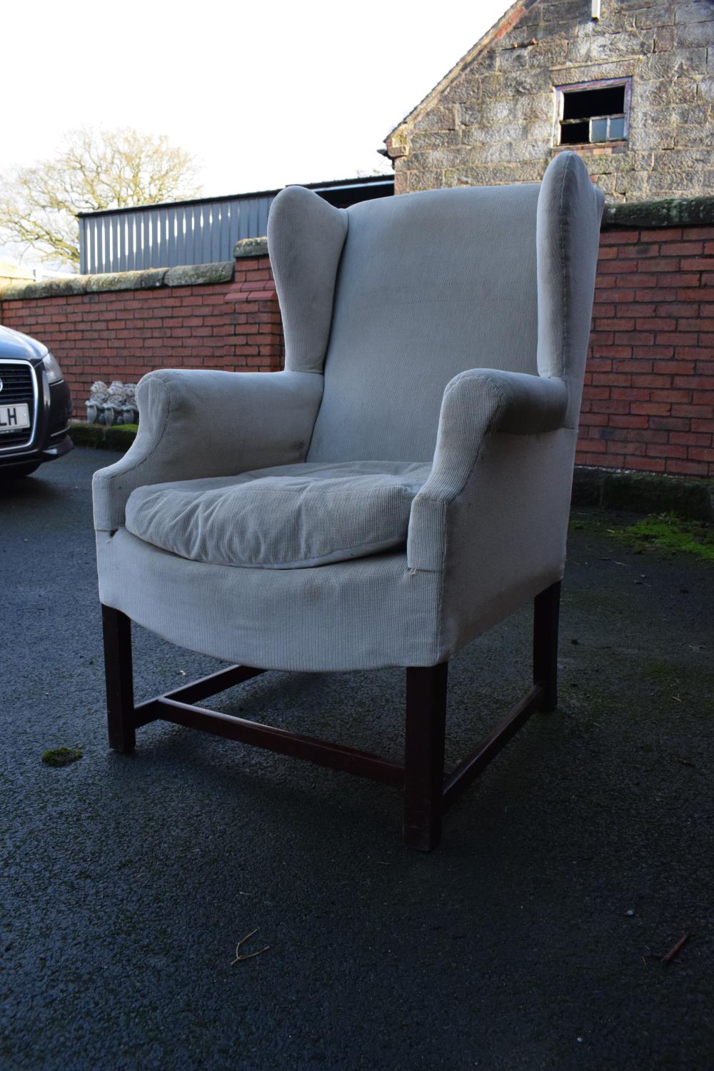 George III style wingback mahogany arm chair. In good condition with age related wear as expected.