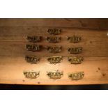 A collection of Edwardian cast brass furniture handles (13) Each one measures 9x5cm. In good