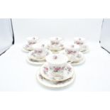 A collection of Royal Albert trios in the Lavender Rose design (6 trios) 3 cups are seconds. 2