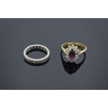 A 9ct dress ring (stamped 375) together with a 9ct eternity ring (stamped 9ct): both with semi-