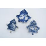 A collection of English 19th century blue and white pickle dishes in the shape of a leaf: with mixed