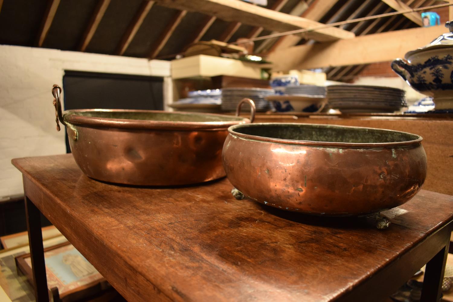 2 Victorian copper shallow planters, one with 2 handles, with the other raised on claw feet (2)