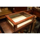 20th century mahogany and glass table top display case. Wear to the wooden edges which are scratched