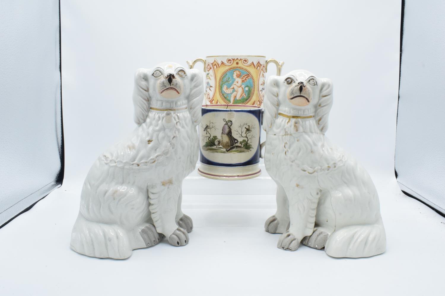19th century Staffordshire pottery to include a pair of dogs, a shepherd mug and a 2 handled