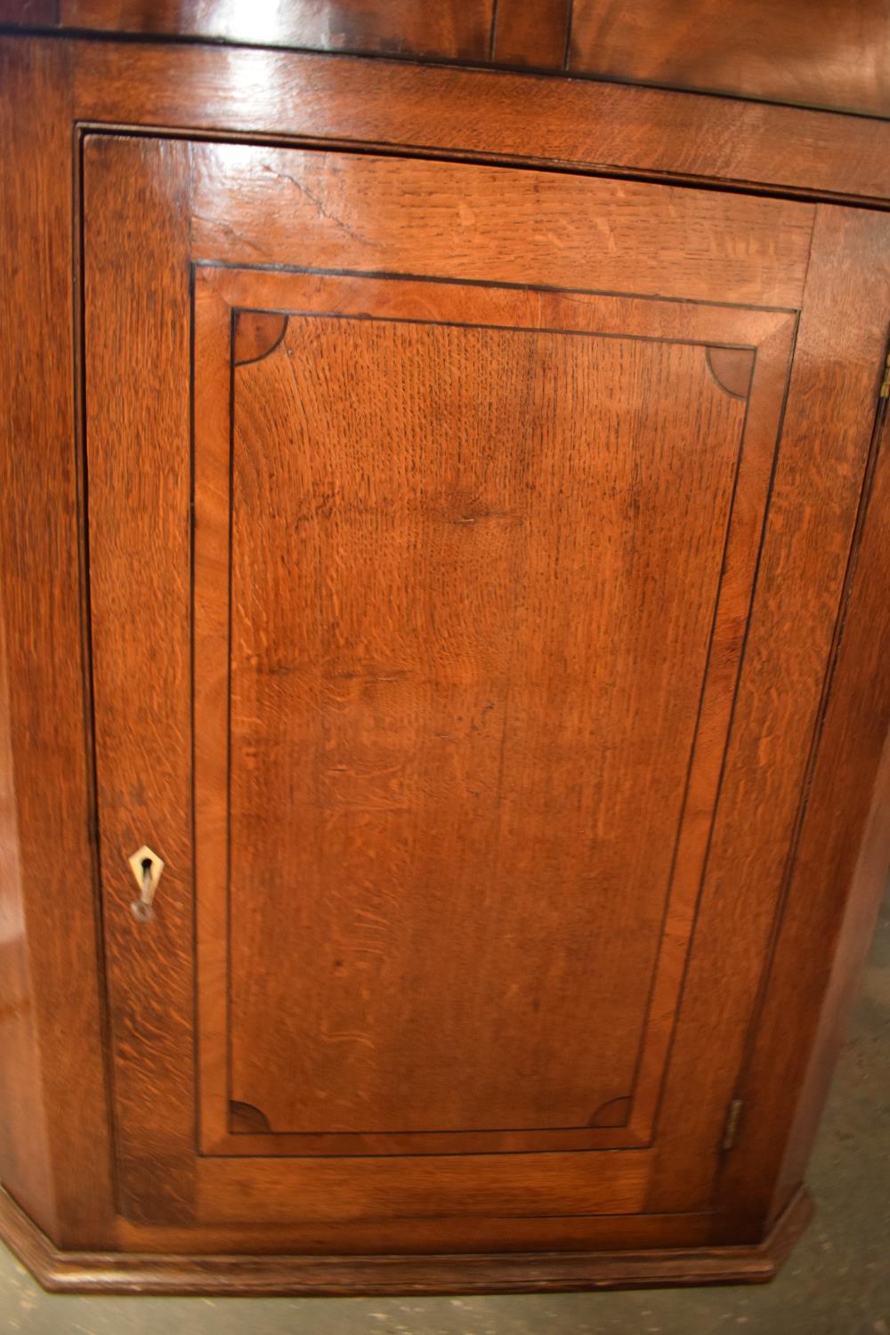 Late Georgian oak inlaid corner cabinet with a bone escutcheon. Some wear and old worm is - Image 2 of 7