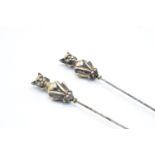 Pair of Victorian brass and steel cat hatpins, 22cm long