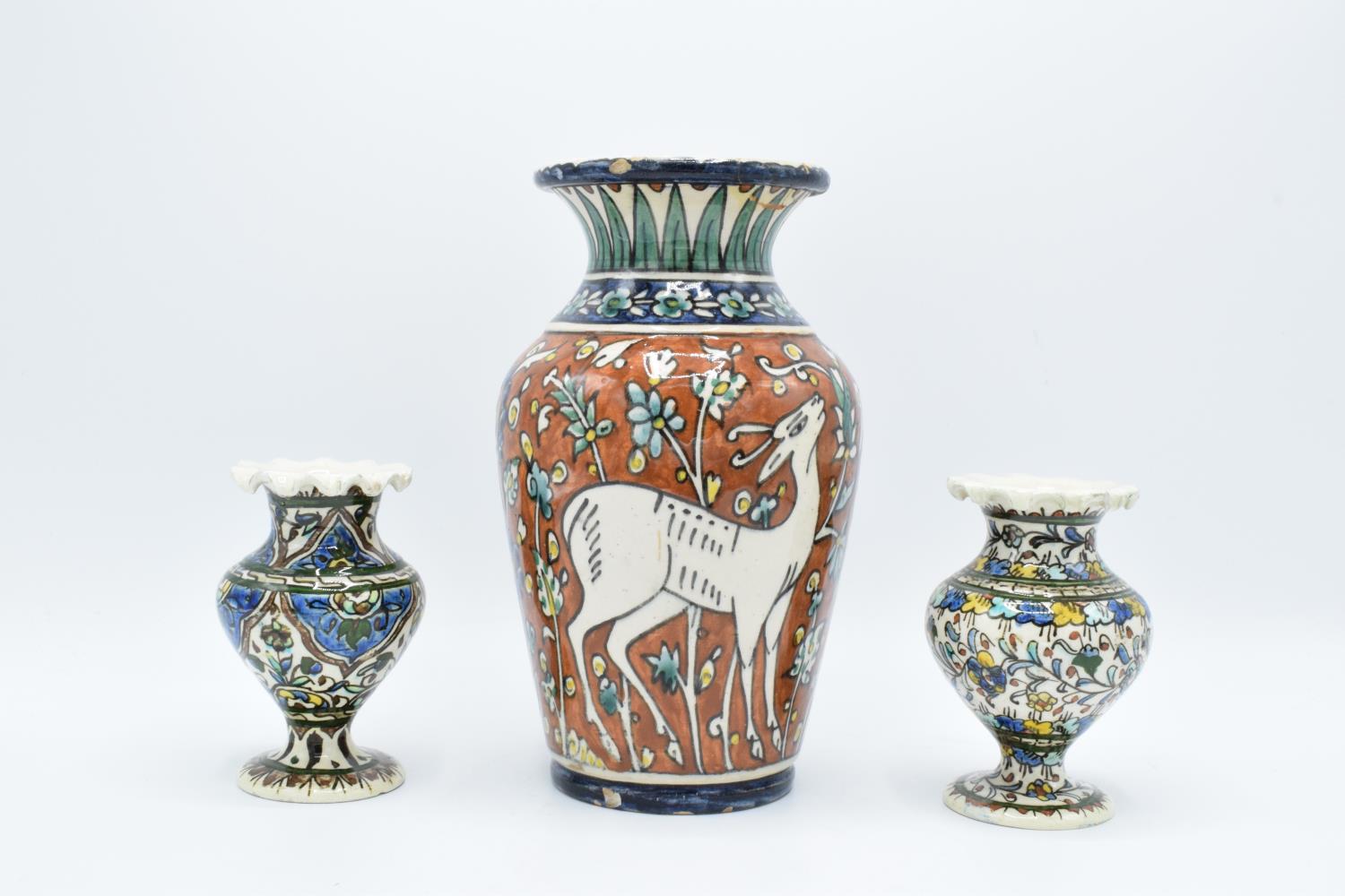 A collection of pottery to include an Iznik of Jerusalem vase with 2 similar items (3) All with