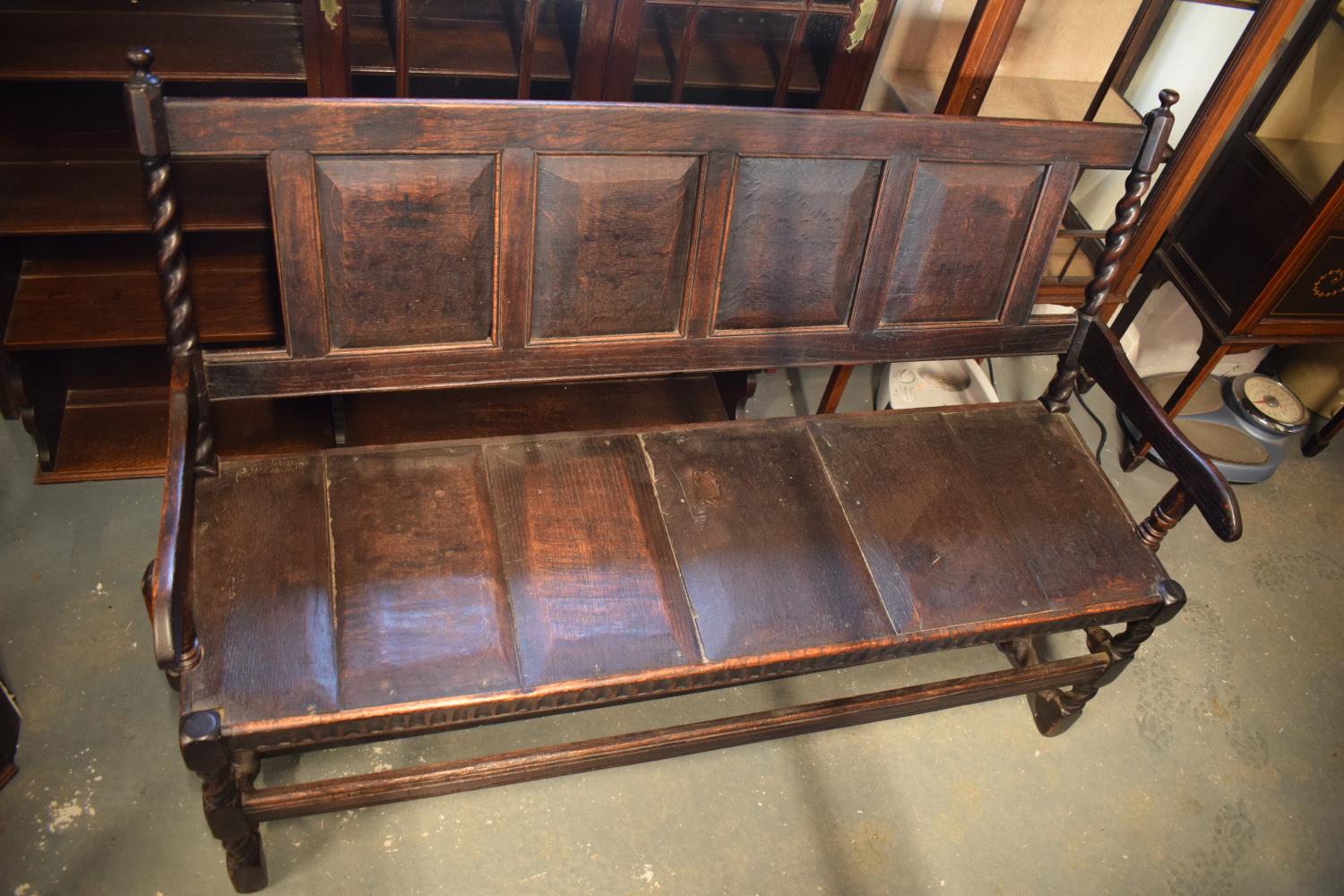 Late 18th century oak carved settle with barley twist supports. In good stable, functional