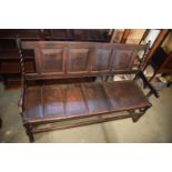 Late 18th century oak carved settle with barley twist supports. In good stable, functional