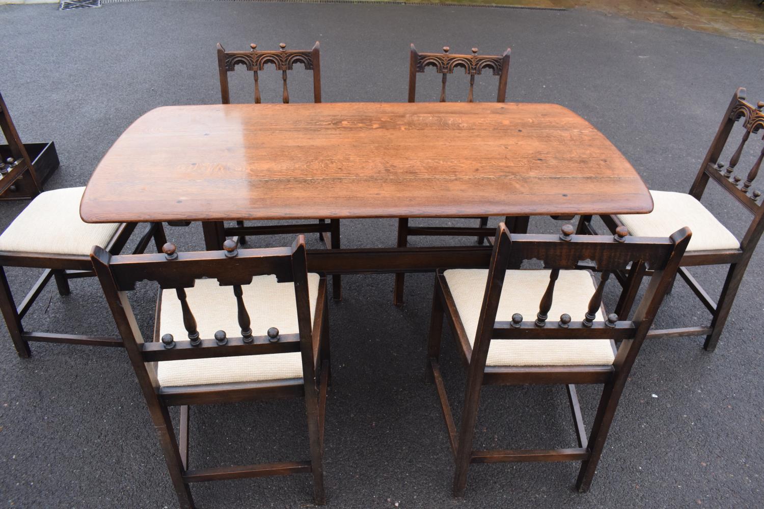 Ercol elm dining table together with 6 matching chairs in a colonial style. Generally in good - Image 2 of 10