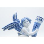 English 19th century Delft model of a cherub holding a cornucopia in a tin glaze. Some chipping to